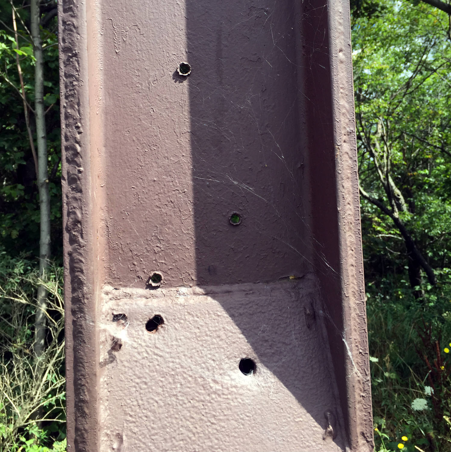 Bullet Holes in The Metal Cross on Calvary Hill in Wayland