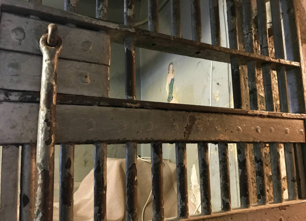 Inmate Art through Cell Door in the Former Wayne County Jail Museum in Lyons, New York