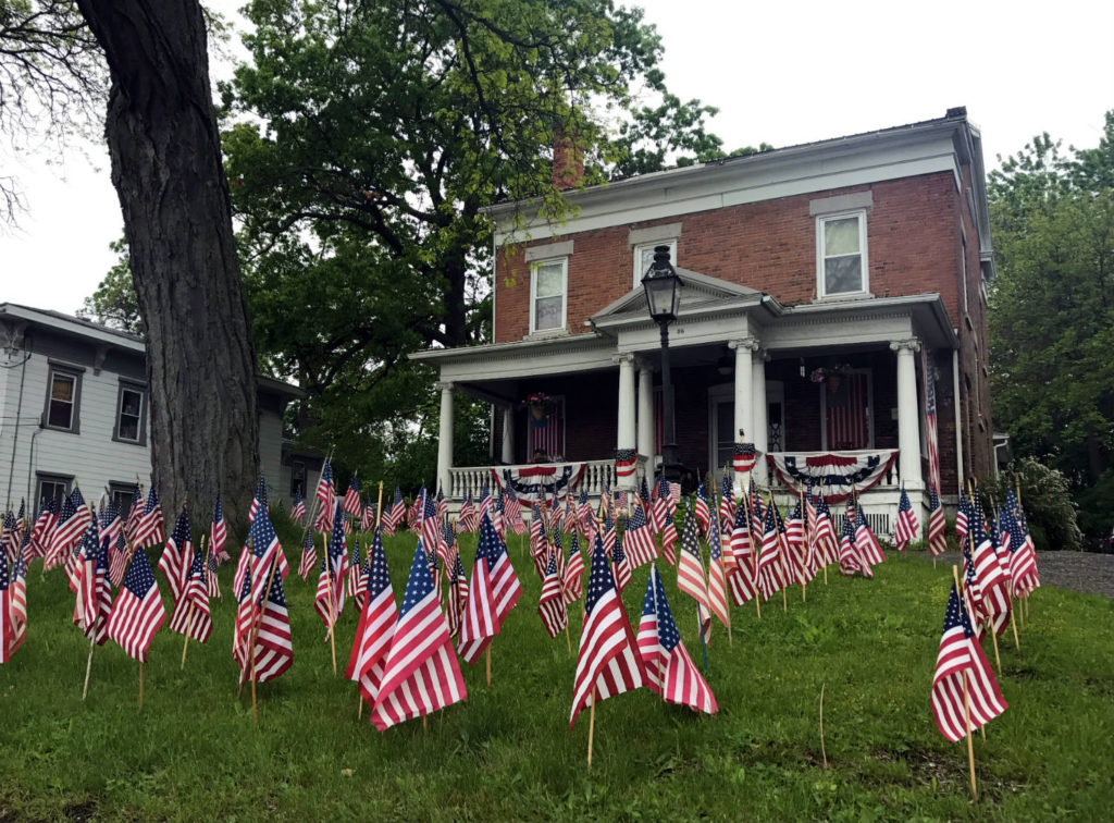 Home in Waterloo, New York with American Flags Display