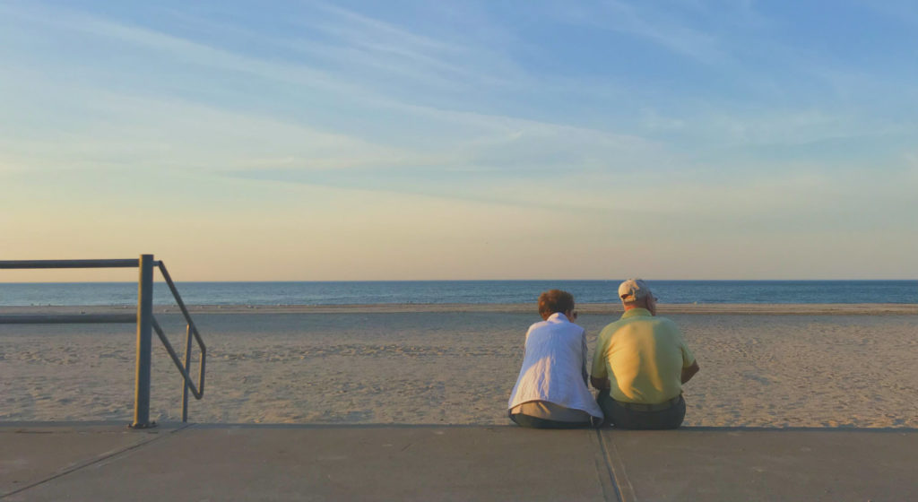 Couple Sitting at Charlotte Beach Park on Lake Ontario