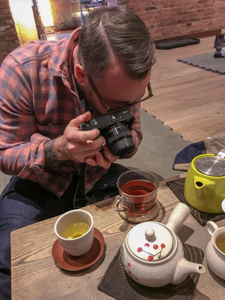 Chris Clemens of Exploring Upstate Photographing Tea at Roji Tea Lounge