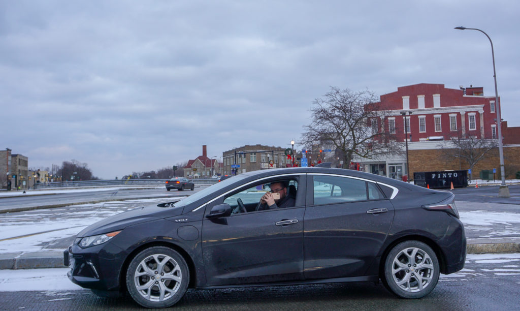 Chris Lindstrom of Food About Town Taking a Photo on Lockport's Big Bridge