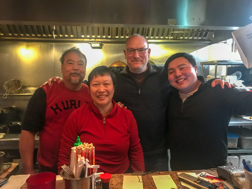 Adam Wilcox with the staff at Ming's Noodles in Rochester